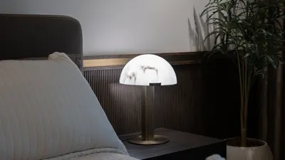Elegant modern bedroom interior with stylish lamp and decor