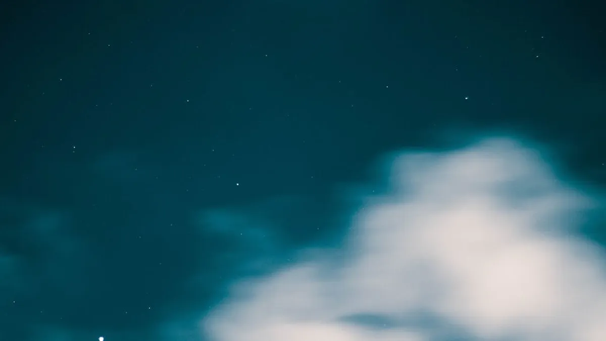 A tranquil starry night sky with ethereal clouds capturing celestial beauty in Karachi, Pakistan.