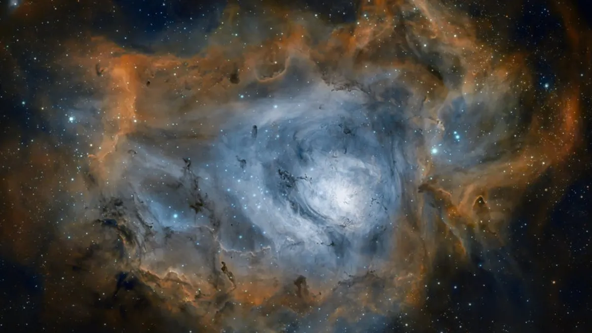 Captivating image of the Lagoon Nebula showcasing colorful cosmic clouds and distant stars.